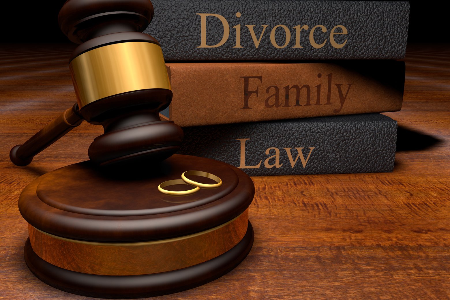 Gavel, divorce law books and wedding rings